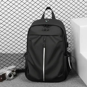 Waterproof black backpack with silver reflective strip and external USB charging port