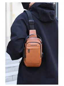 Brown leather sling bag for men with USB port and anti-theft lock detail