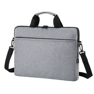Slim grey laptop sleeve with shoulder strap for MacBook and ultrabooks, 45-degree angle