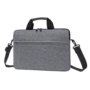 Professional grey laptop briefcase with handles and detachable shoulder strap in macro texture