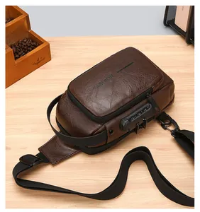 Detail of dark brown leather texture and security combination lock on chest bag
