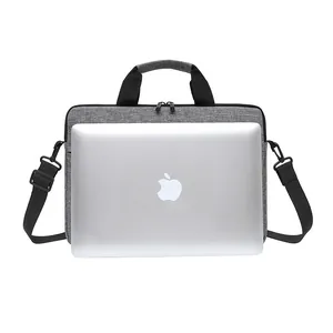 Close-up of durable dark grey laptop sleeve with dual zippers and sturdy black handles