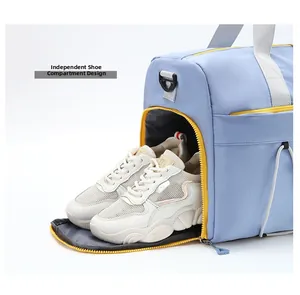 Light blue travel bag featuring an independent shoe compartment with yellow zipper details