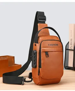 Detailed view of the anti-theft combination lock on a brown leather men's chest bag