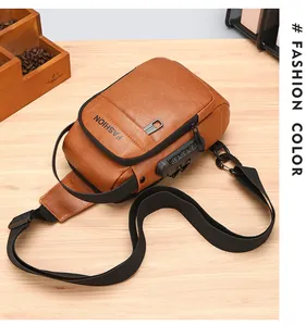 Close-up of brown leather bag with security combination lock and pebbled texture