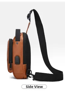 Side view of brown lychee grain leather sling bag with USB charging port and zipper