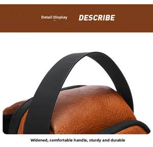 Close-up of widened comfortable carry handle and durable lychee texture on brown chest bag