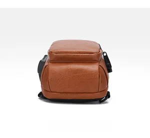 Detailed bottom view of brown PU leather sling bag with textured finish and side port
