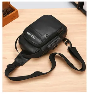 Close-up of black leather chest bag with security combination lock and textured finish