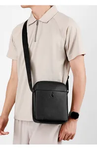 Detail of lychee pattern leather shoulder bag with adjustable branded strap for men