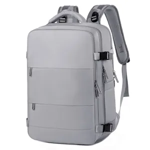 Zaino da viaggio grigio minimalista in tessuto impermeabile con fibbie laterali