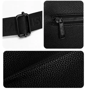Detail of lychee textured leather, kangaroo logo zipper and adjustable nylon strap