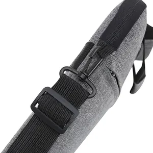 Waterproof laptop bag in gray fabric with detachable shoulder strap and durable zipper