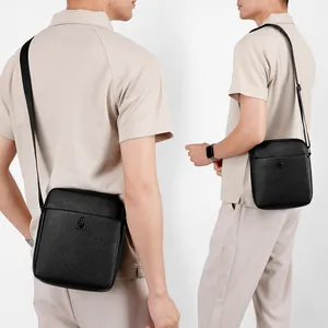 Men's black lychee pattern leather crossbody bag with adjustable strap for daily commute