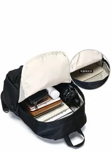Interior view of black travel backpack showing spacious laptop compartment and multi-pockets
