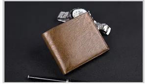 Brown leather wallet with lychee grain texture alongside a watch and pen