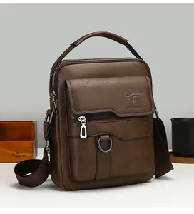 Close-up of brown pebbled leather texture and kangaroo logo on men's messenger bag