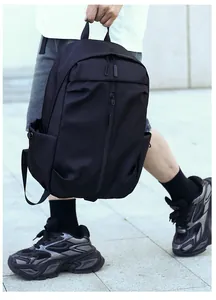 Side view of a black waterproof nylon backpack for travel and daily commuting