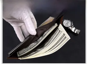 Interior view of brown leather wallet showing bill compartment and ID window for men