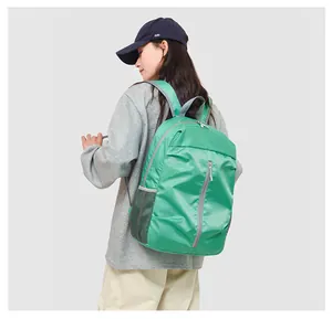 Close-up of lightweight green travel backpack with durable tear-resistant honeycomb fabric