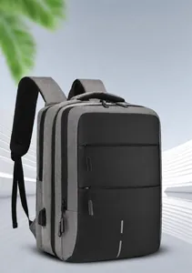 Detail of multi-layer storage compartments and USB charging port on Oxford backpack