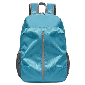 Light blue sport backpack with diamond grid texture and gray mesh side pockets for outdoor travel