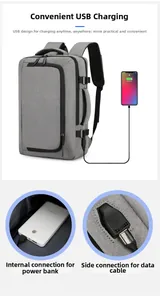 Detail of laptop backpack showing integrated USB charging port and internal power bank cable