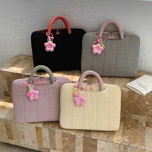 Quilted 16-inch laptop handbag with floral pendant and double zippers in various colors
