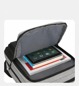 Front compartment detail of the waterproof oxford backpack showing tablet and book storage