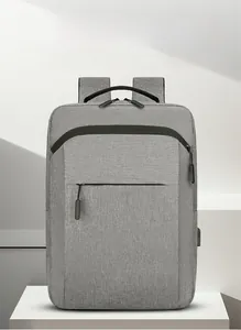 Macro shot of waterproof fabric and integrated USB charging port on grey backpack