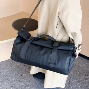 Bolso de viaje negro de gran capacidad en nailon impermeable con correa ajustable