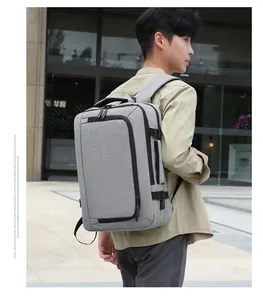 Grey business laptop backpack with waterproof fabric shown from a side view on a model