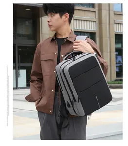 Side view of a grey waterproof oxford fabric commuter backpack on a male model outdoors