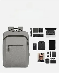 Deep gray waterproof laptop backpack showing spacious interior storage and USB charging port