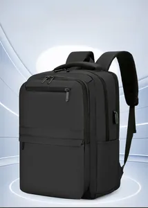 Detail view of black business backpack with external USB charging port and multi-layer pockets