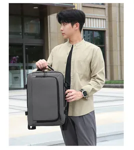 Detailed view of the 16-inch gray laptop backpack carried by a model in casual style