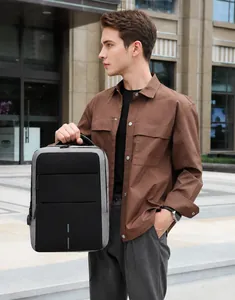 Waterproof laptop backpack featuring USB charging port and reflective safety strips