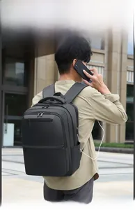 Detail of expandable black business travel laptop backpack with external USB charging port