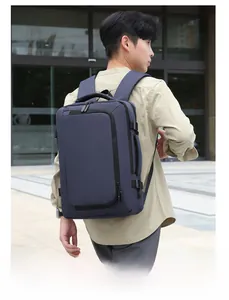 Side view of modern blue business laptop backpack worn by a man during outdoor commute