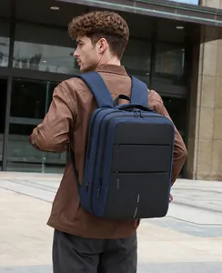 Waterproof navy blue oxford business backpack with USB port shown in an urban setting