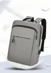 Detailed view of the lightweight grey water-resistant laptop backpack with USB port