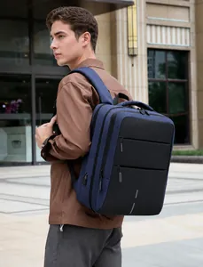 Outdoor view of a waterproof laptop backpack with USB charging port and multi-compartment
