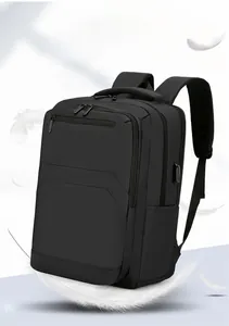 Detail of lightweight black business backpack showing external USB port and nylon texture