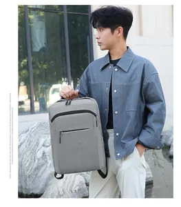 Detail view of a gray waterproof business laptop backpack made of durable textured fabric