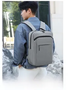 Outdoor shot of a waterproof grey 16-inch laptop backpack with textured fabric