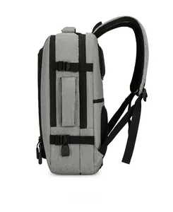 Side view of gray laptop backpack showing reinforced handle and side mesh pocket