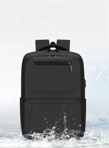 Close-up of waterproof black business backpack with water splashes showing repellent coating
