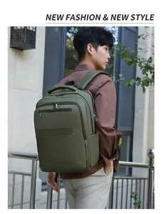 Detail of army green waterproof backpack with external USB port and metal zippers