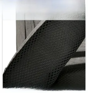 Detail of breathable black honeycomb mesh shoulder strap on durable business backpack