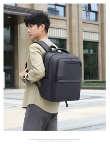 Close-up of wide padded shoulder straps on a grey expandable business travel backpack